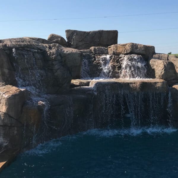 Large hand carved boulders with slide and waterfall